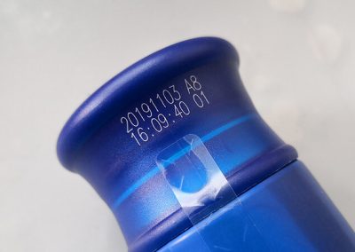 UV laser printing on plastic bottle