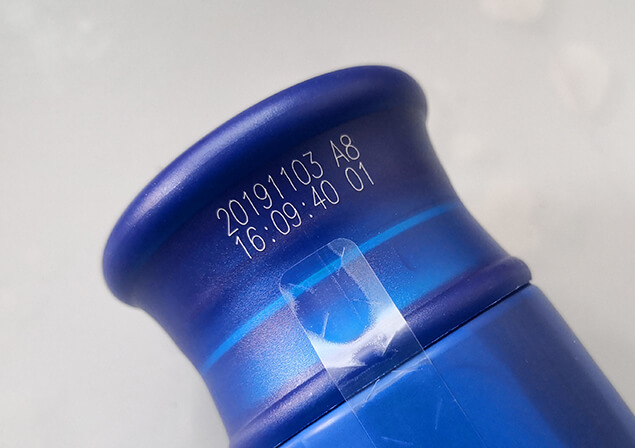 UV laser printing on plastic bottle